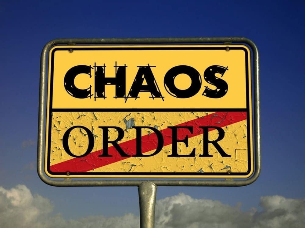 Sign reading "CHAOS" above "ORDER," crossed by a red stripe