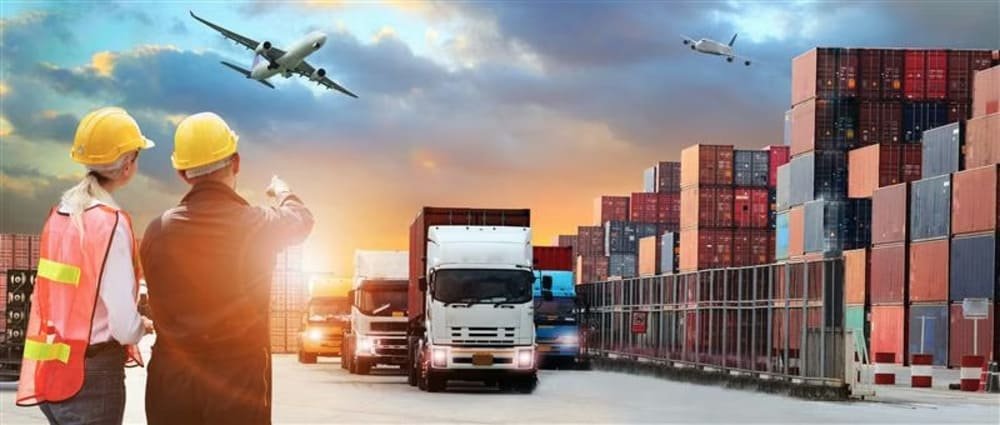 Logistics scene with workers, trucks, shipping containers, and airplanes at sunset
