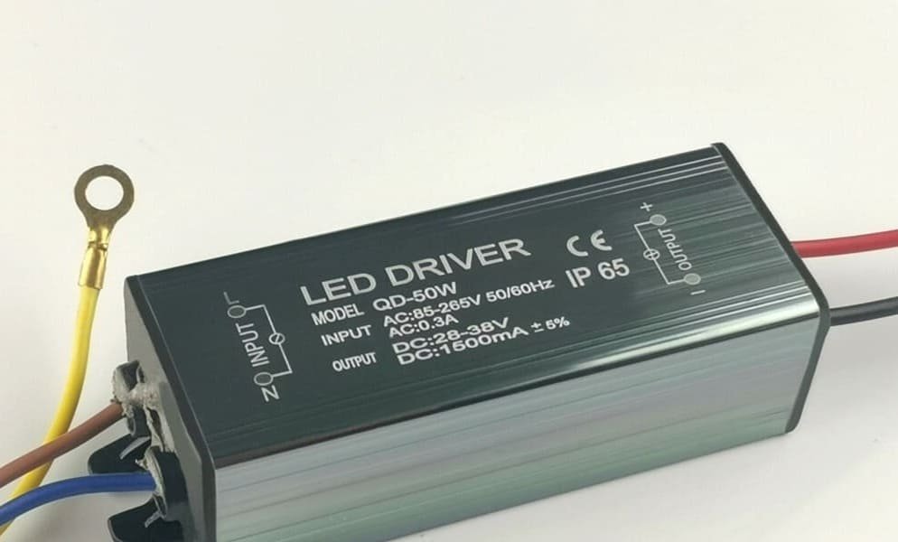Rectangular LED driver with wiring and technical specifications on a black and silver casing