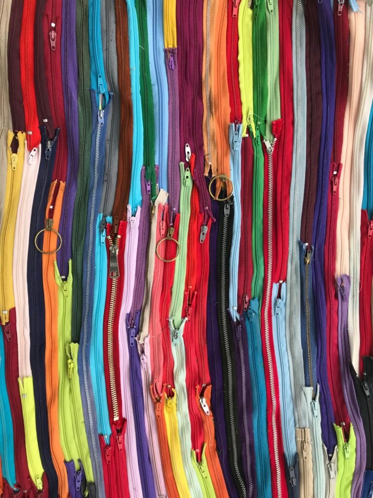 Colorful zippers arranged for garment accessory sourcing