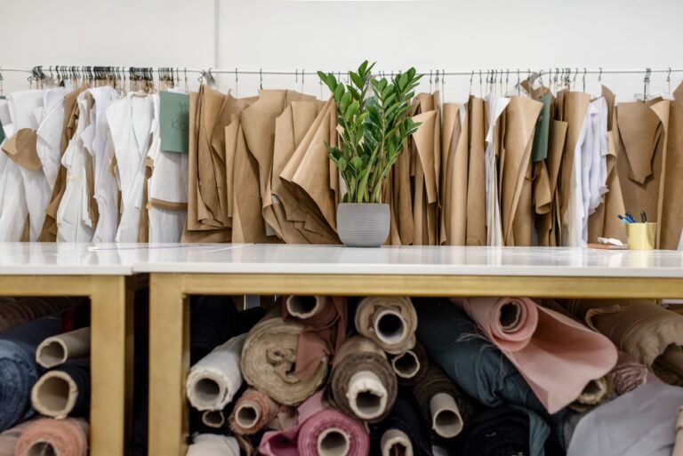 Fabric rolls and textile patterns in a fashion studio