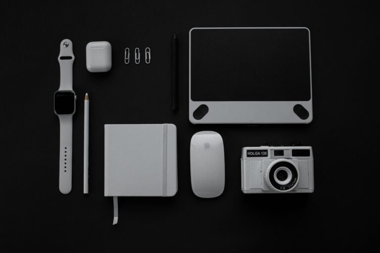 Modern consumer electronics and accessories arranged in a flat lay