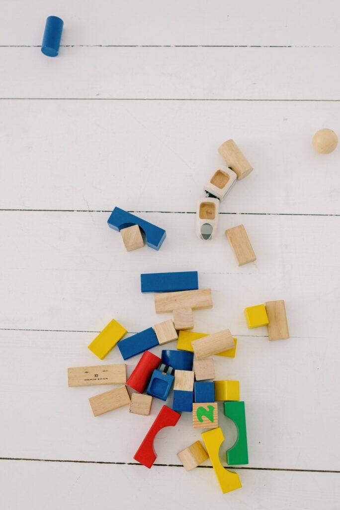 Colorful kids building blocks arranged on a light background