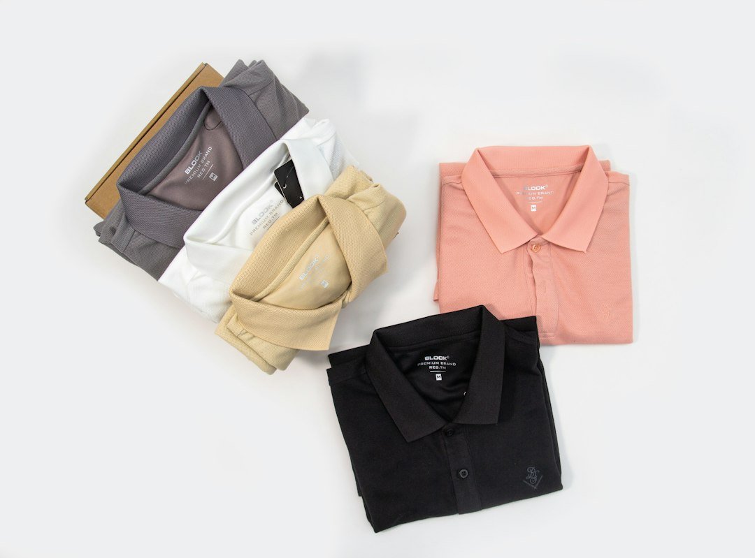 Four coordinated polo shirts in different colors for corporate and school uniform sourcing