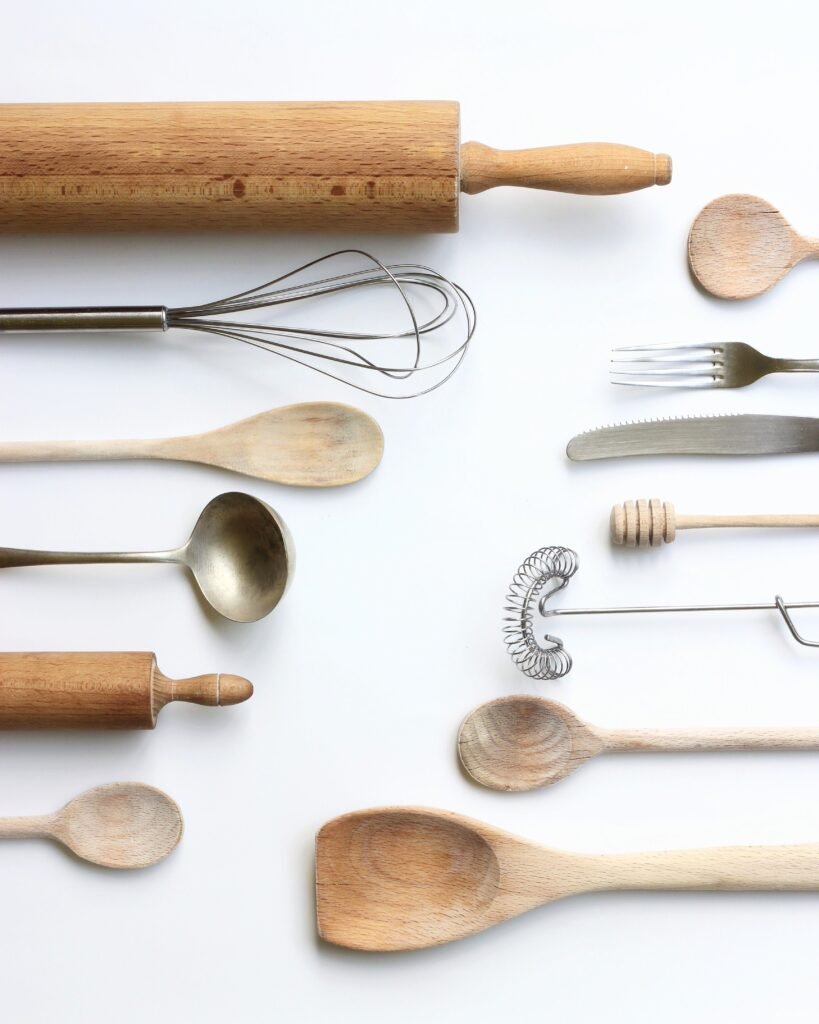Kitchen utensils and household accessories on a light background