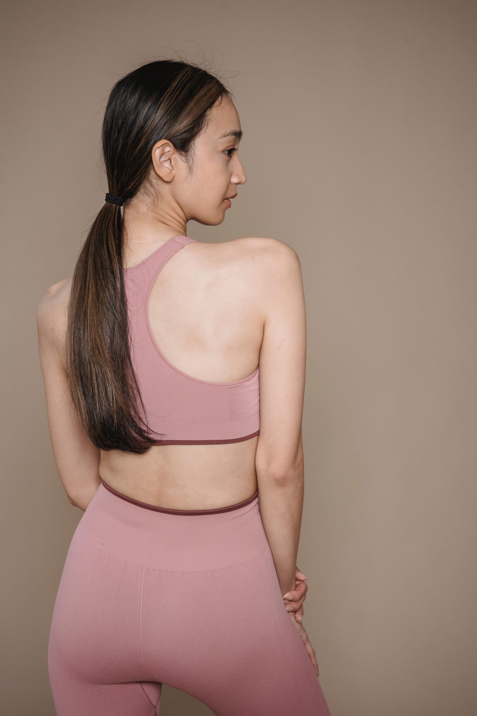 Matching pink sportswear activewear top and leggings